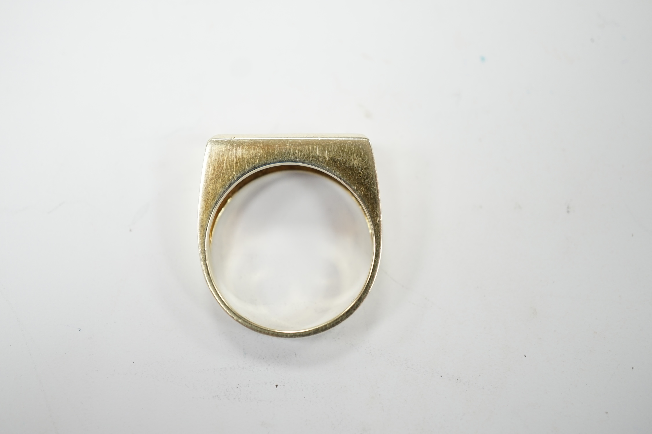 A 585 yellow metal and channel set four stone diamond ring, size P, gross weight 6.2 grams. Good condition.